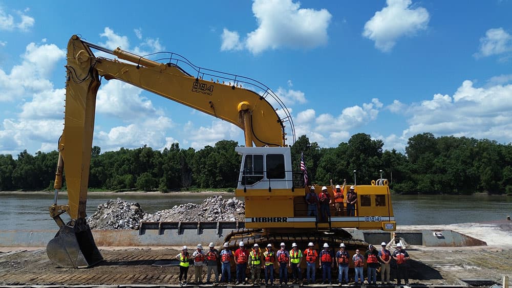 Luhr Crosby crew in front of equipment